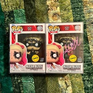 Alexa Bliss 107 Chase. Pair, one signed. Funko Pop. WWE. JSA authentication.